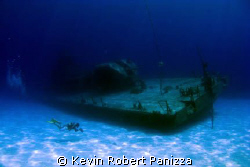 Videographer shooting the Shipwreck Tibbits in Cayman Bra... by Kevin Robert Panizza 